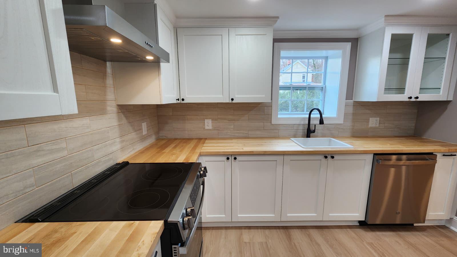1407 Sunken Road Fredericksburg, VA 22401 - Photo 16 of 39 a kitchen with a sink and cabinets