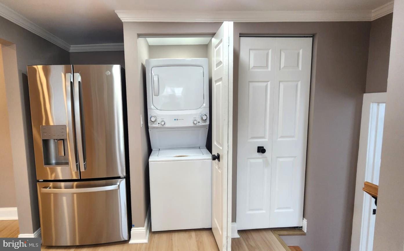 1407 Sunken Road Fredericksburg, VA 22401 - Photo 20 of 39 a view of storage and utility room with refrigerator and wooden floor