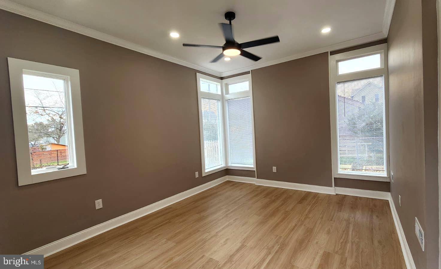 1407 Sunken Road Fredericksburg, VA 22401 - Photo 23 of 39 a view of an empty room with a window and wooden floor