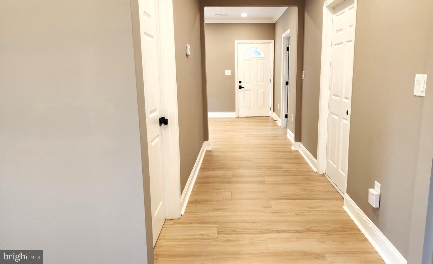 1407 Sunken Road Fredericksburg, VA 22401 - Photo 8 of 39 a view of a hallway with wooden floor and staircase