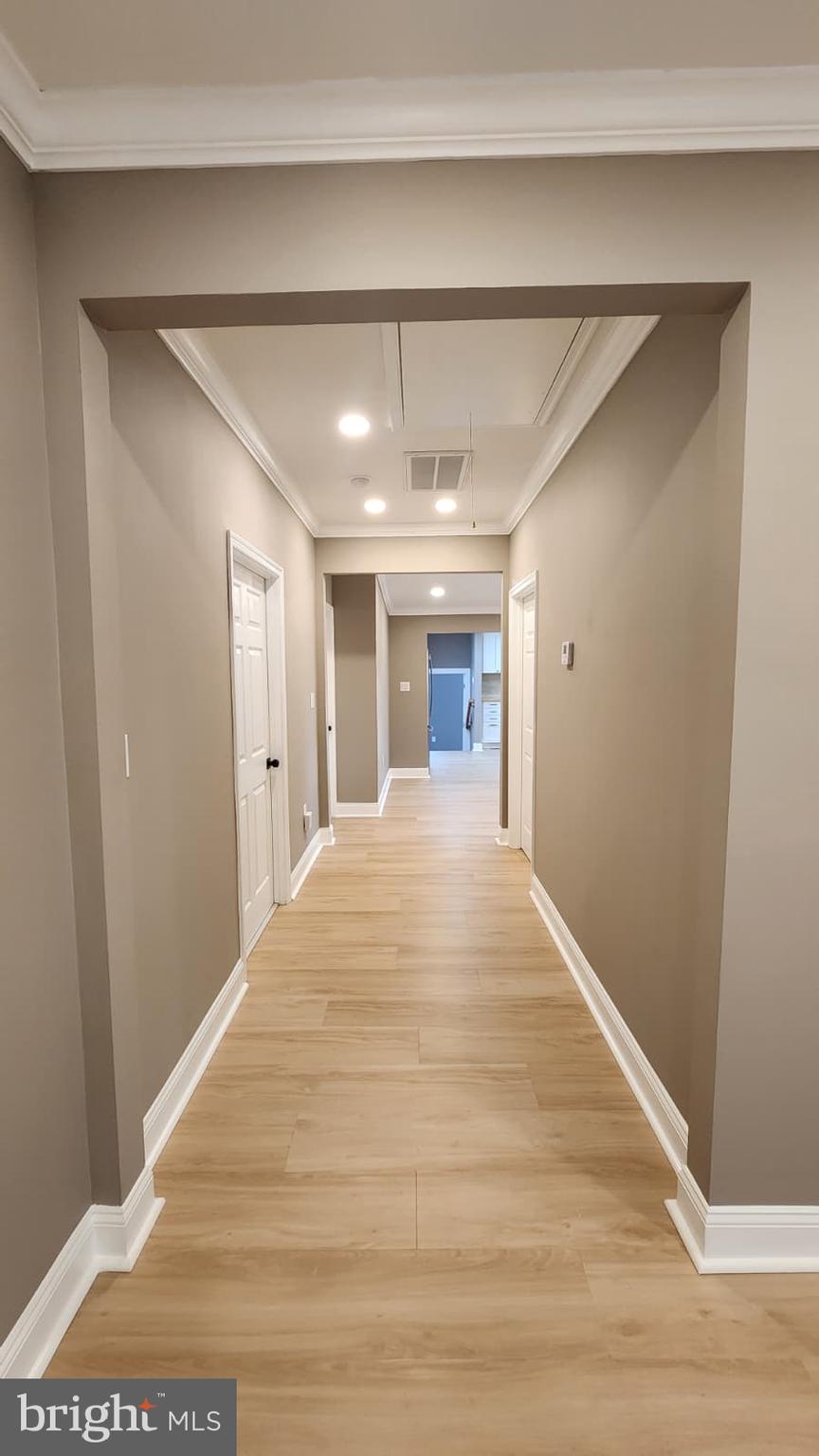 1407 Sunken Road Fredericksburg, VA 22401 - Photo 10 of 39 a view of a hallway with wooden floor and chandelier