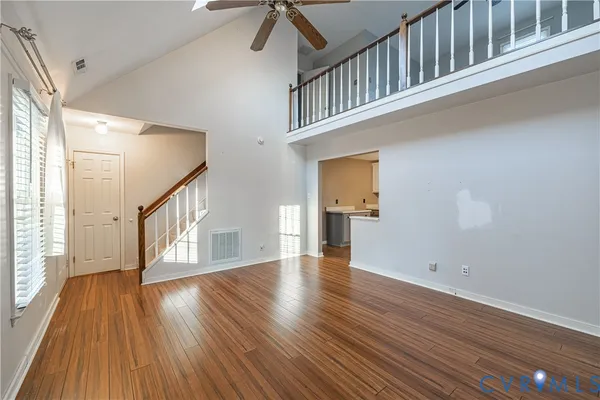 a view of an entryway with wooden floor