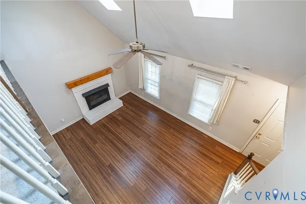 a view of an entryway with wooden floor