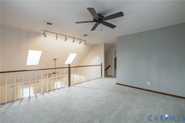 a view of staircase with white walls