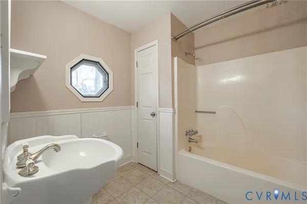 a bathroom with a sink and a bathtub