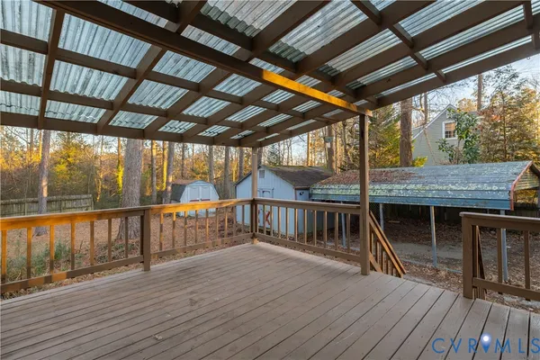 a view of a balcony with wooden floor