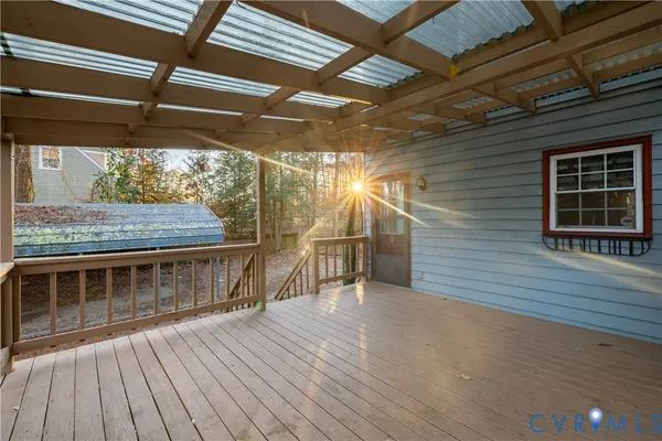 a view of outdoor space with wooden deck