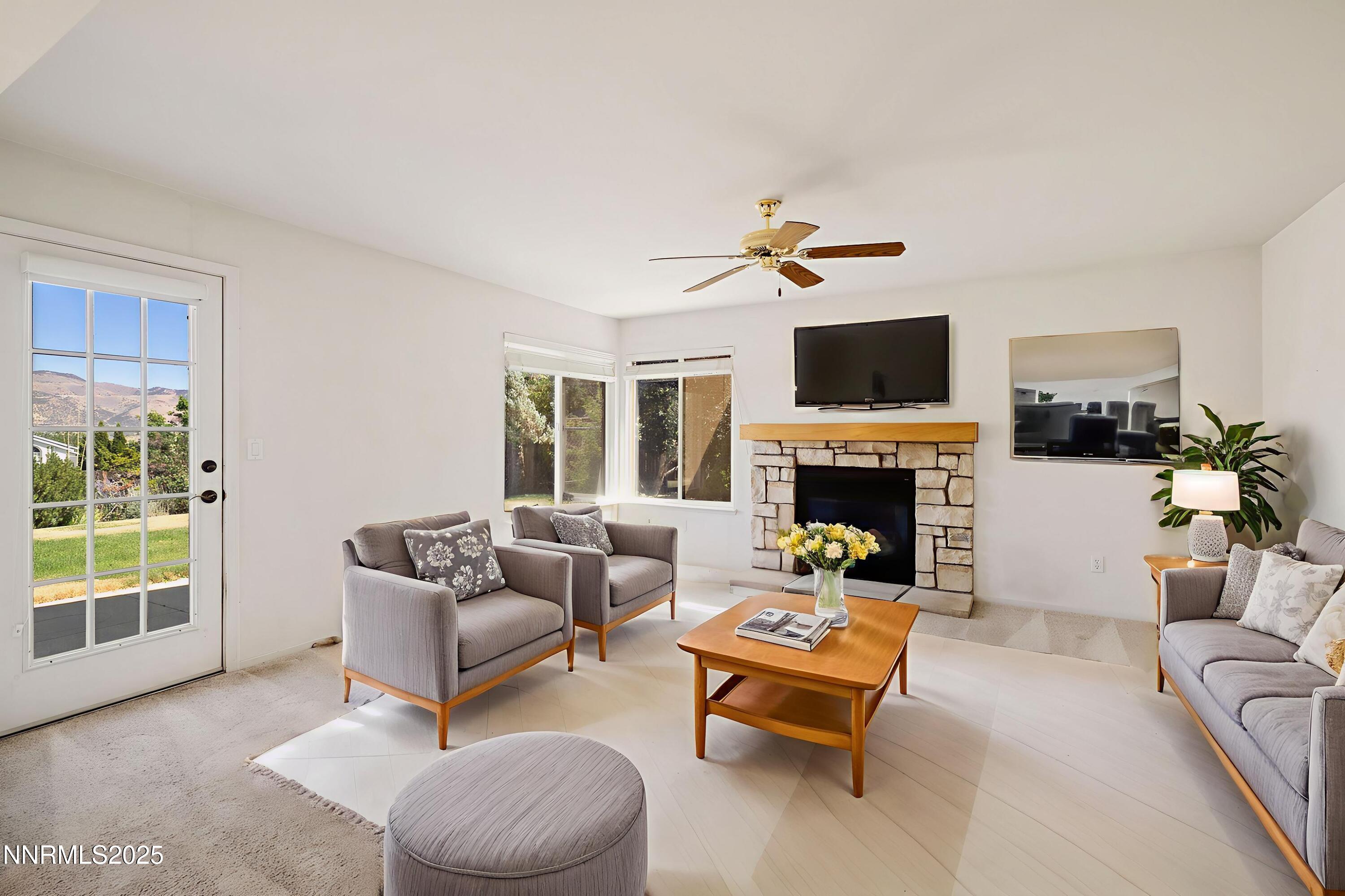 14330 Ghost Rider Drive Reno, NV 89511 - Photo 11 of 41 a living room with furniture and a fireplace