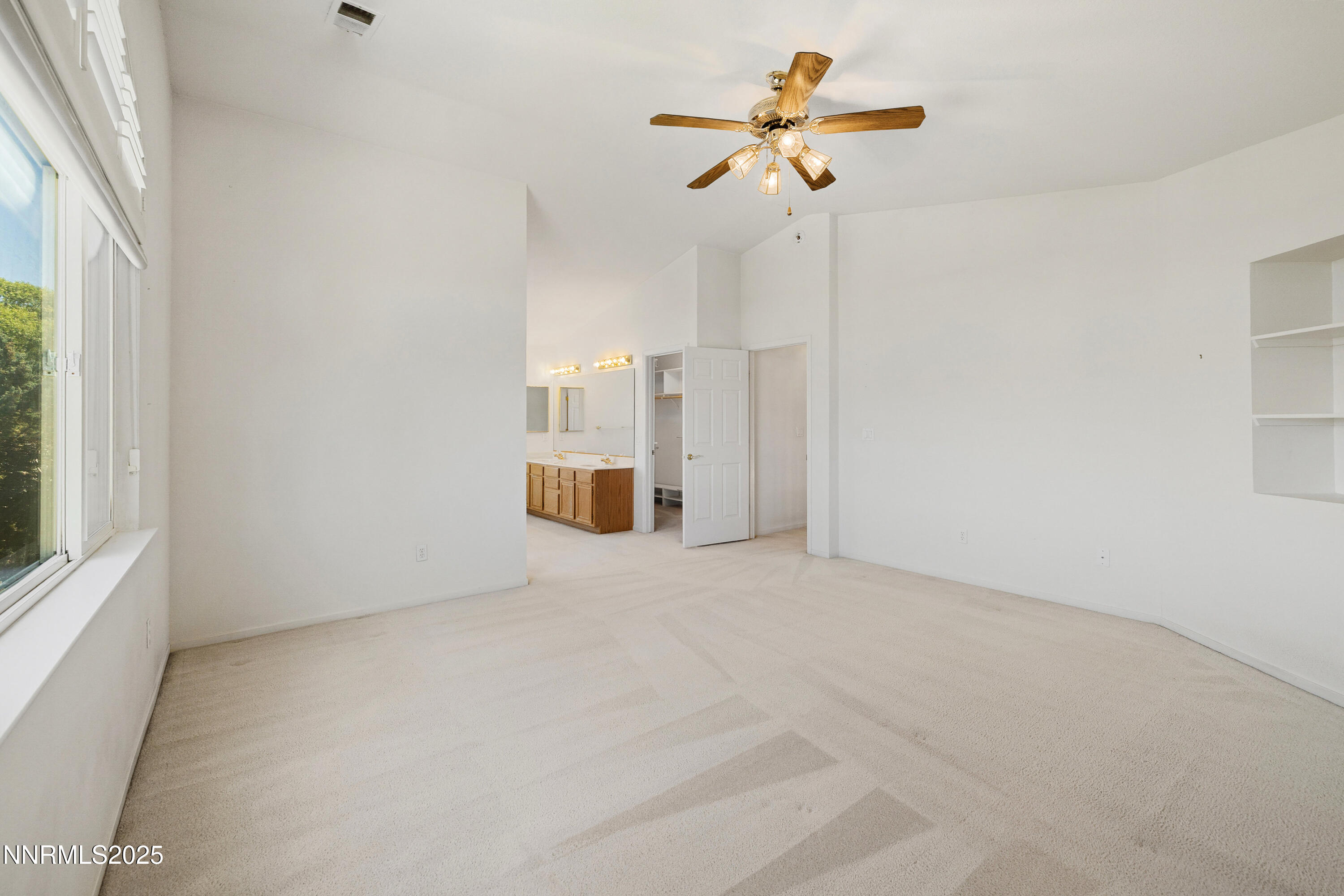 14330 Ghost Rider Drive Reno, NV 89511 - Photo 13 of 41 a view of a room with a ceiling fan and window