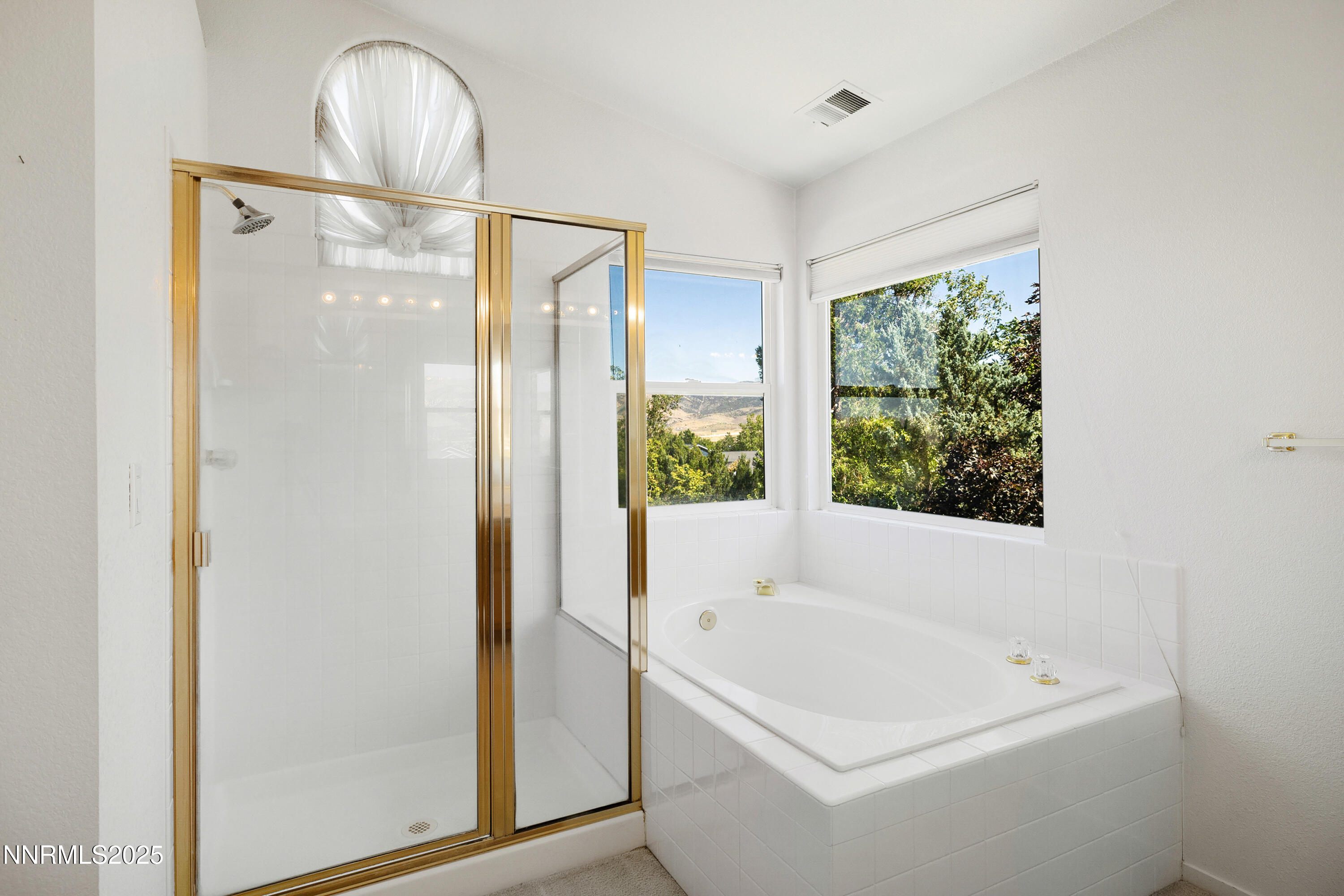 14330 Ghost Rider Drive Reno, NV 89511 - Photo 16 of 41 a white bath tub sitting next to a shower