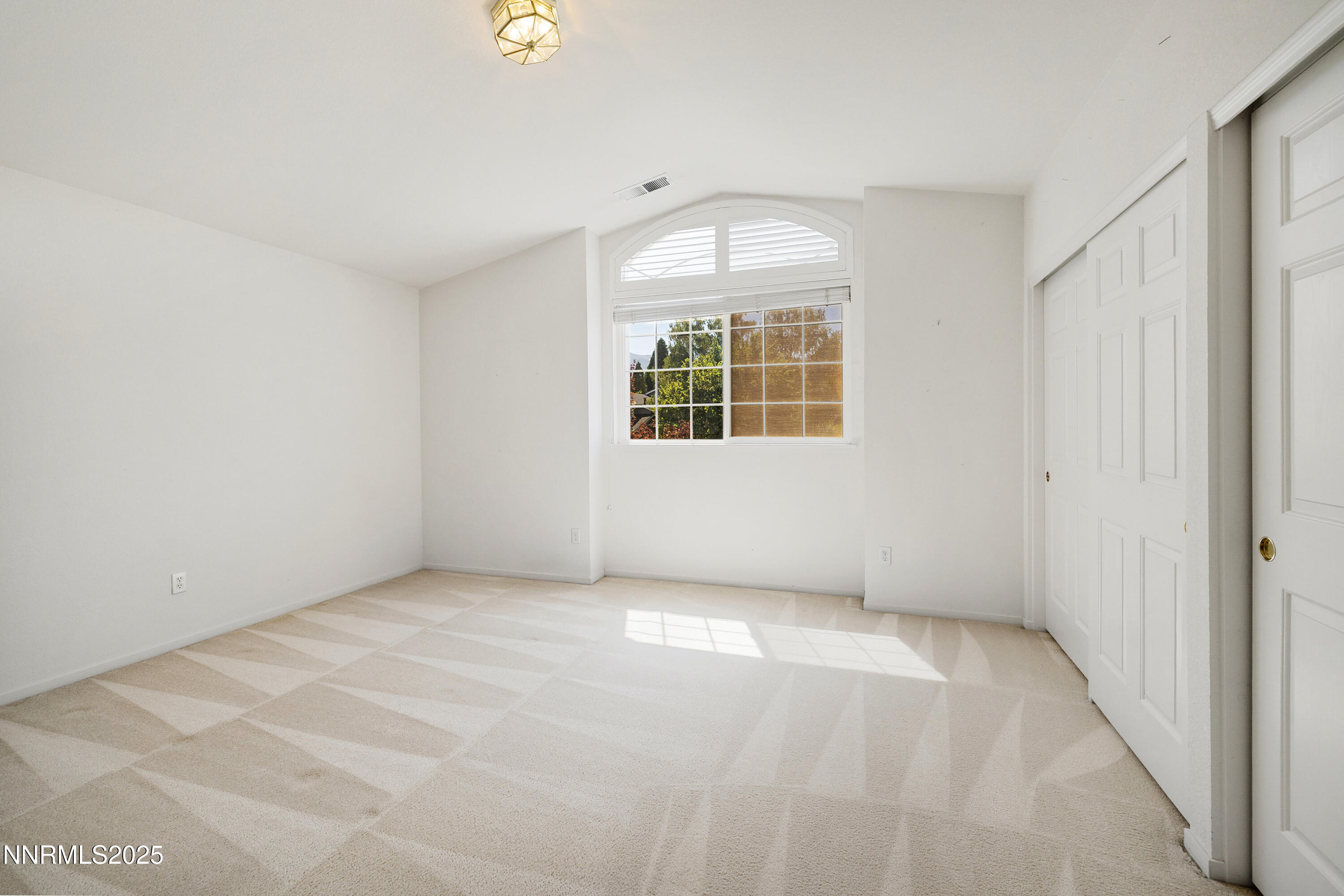 14330 Ghost Rider Drive Reno, NV 89511 - Photo 18 of 41 an empty room with windows