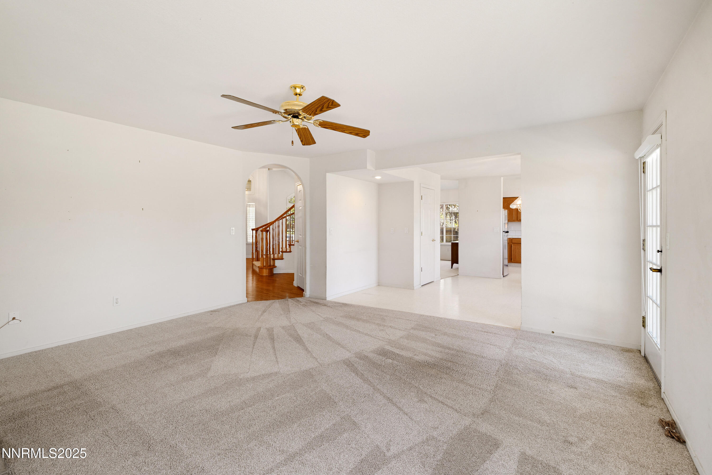 14330 Ghost Rider Drive Reno, NV 89511 - Photo 28 of 41 a view of a livingroom with a ceiling fan and window