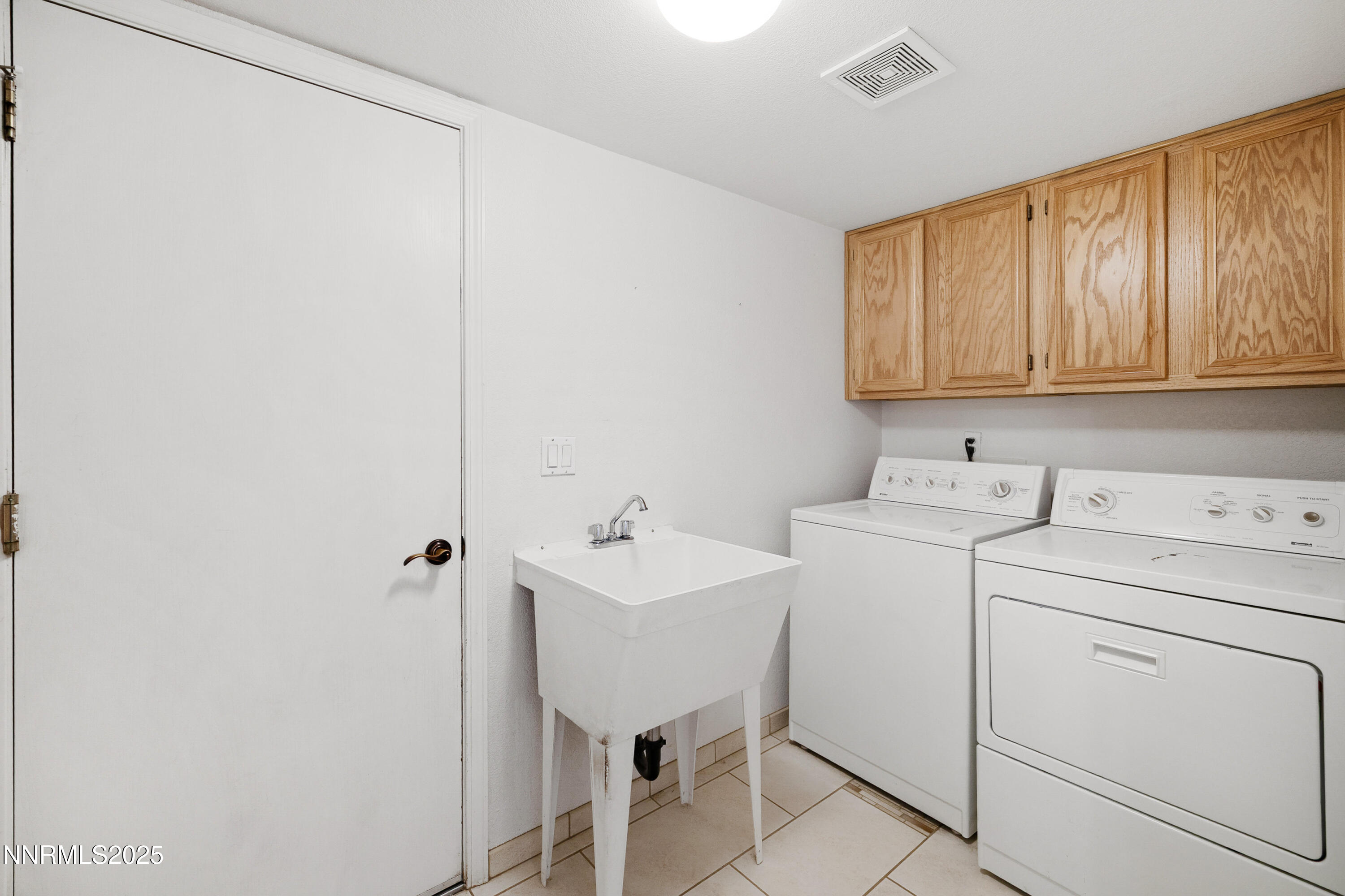 14330 Ghost Rider Drive Reno, NV 89511 - Photo 30 of 41 a utility room with dryer and washer