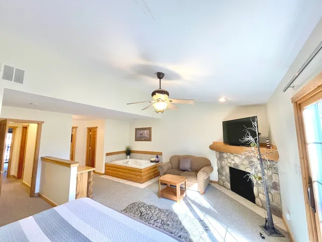 a living room with furniture fireplace and flat screen tv