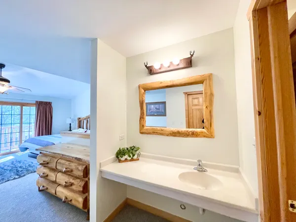 a bathroom with a sink and a mirror