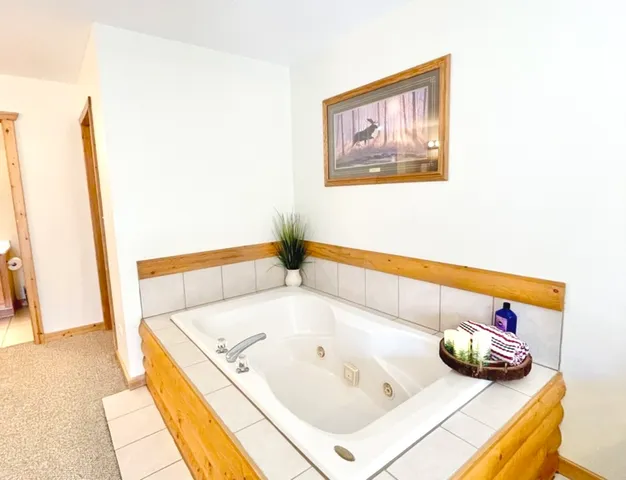 a bathroom with a tub and sink