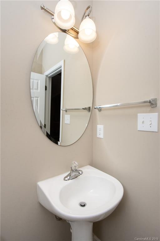 9824 Caldwell Depot Road Cornelius, NC 28031 - Photo 16 of 29 a bathroom with a sink and mirror