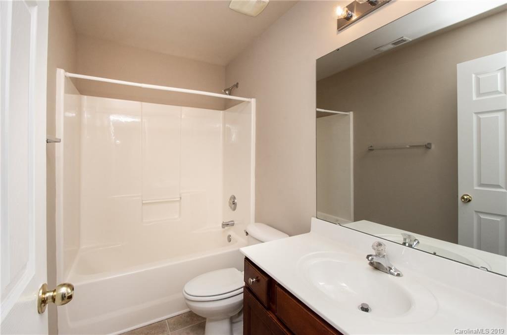 9824 Caldwell Depot Road Cornelius, NC 28031 - Photo 23 of 29 a bathroom with a sink a toilet and shower