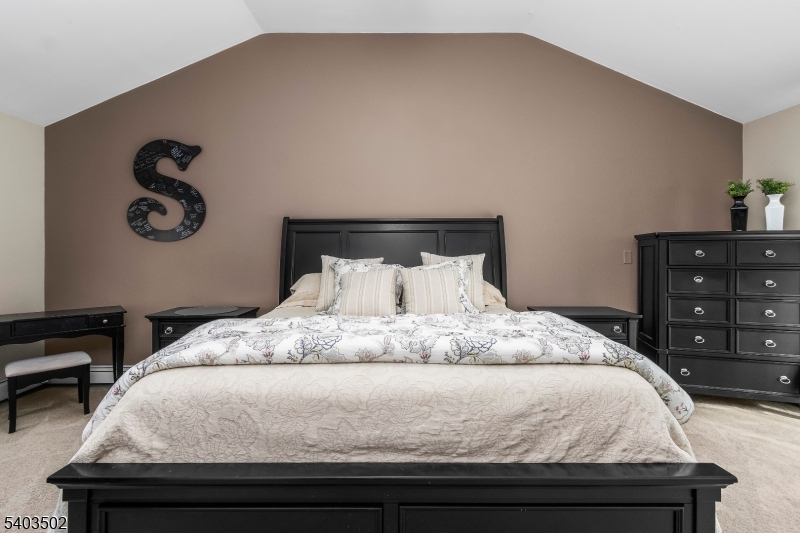 538 Vail Road Landing, NJ 07850 - Photo 13 of 26 a bedroom with a bed and a dresser