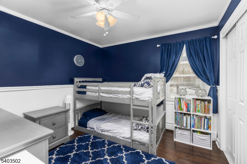 538 Vail Road Landing, NJ 07850 - Photo 16 of 26 a living room with furniture a bookshelf and a chandelier