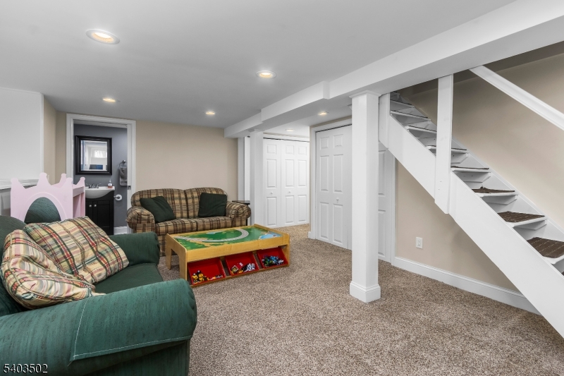 538 Vail Road Landing, NJ 07850 - Photo 20 of 26 a living room with furniture and stairs