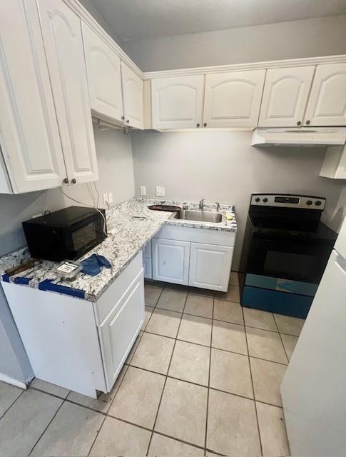 5205 Hudson Bend Road Austin, TX 78734 - Photo 12 of 21 a kitchen with a stove a sink and cabinets