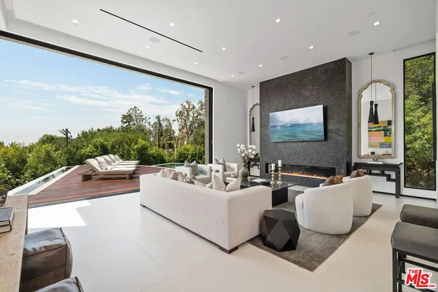 a view of a patio with chairs and table