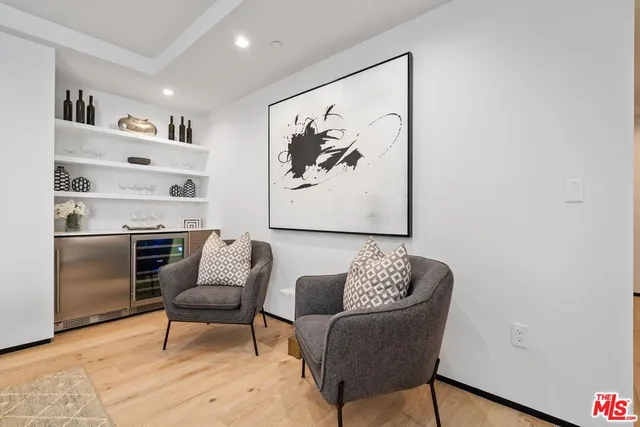 a living room with furniture and a lamp