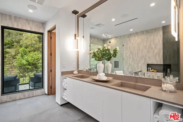 a view of a bathroom with a tub and shower