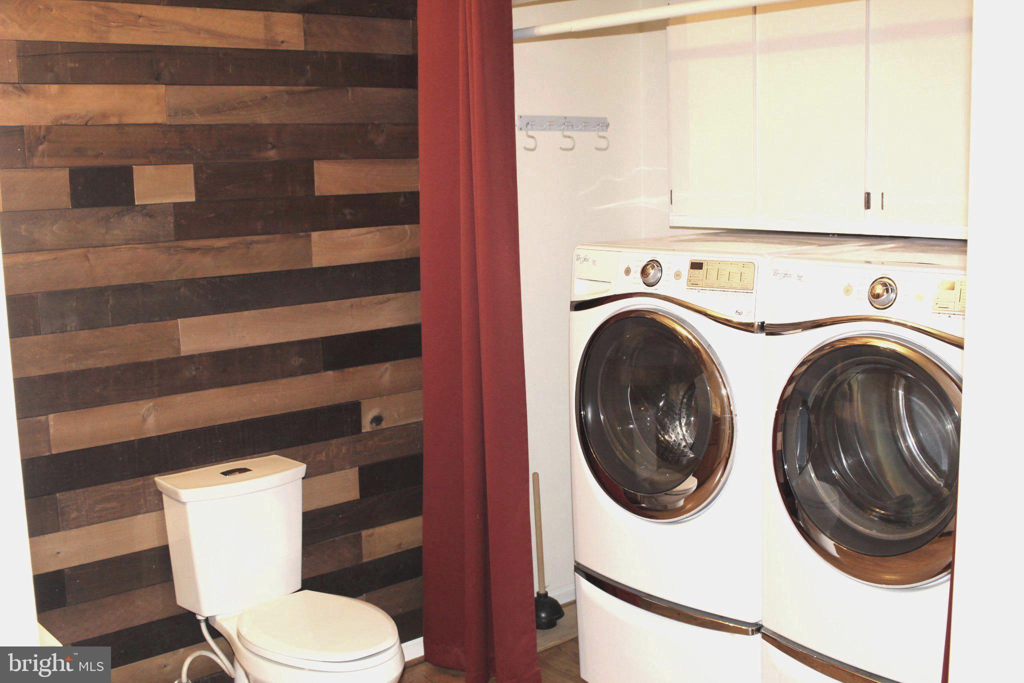 4511 Sudley Road Gainesville, VA 20155 - Photo 10 of 16 Chic laundry nook with rustic flair.