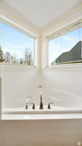 1238 Canyon View Road Midway, UT 84049 - Photo 21 of 36 Corner soaking tub with polished chrome fixtures, surrounded by white subway tile and two large windows