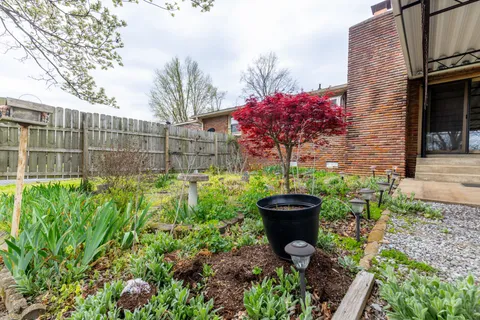 a view of a backyard with garden
