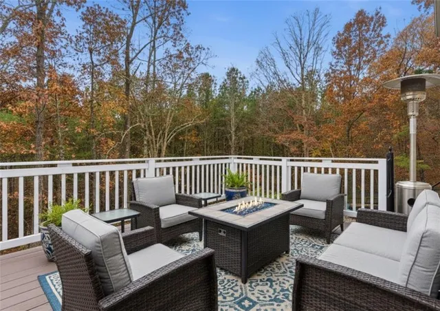 a view of a chair and table on the deck