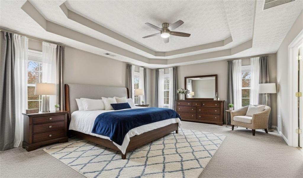 125 Nelson Oaks Drive Ball Ground, GA 30107 - Photo 20 of 41 a bedroom with a bed and furniture