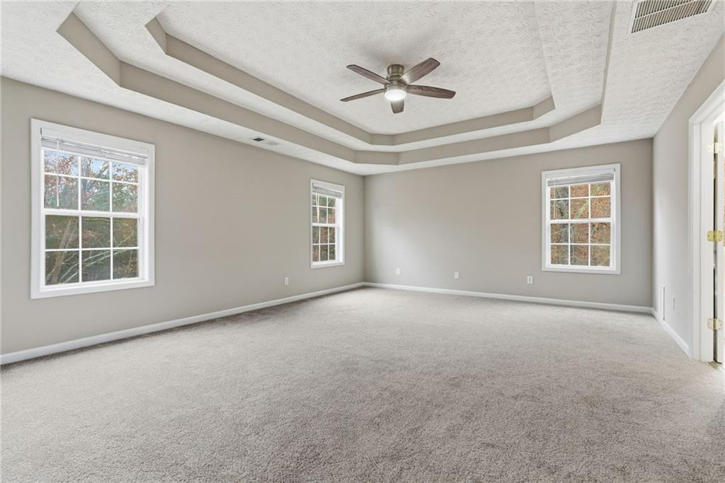 125 Nelson Oaks Drive Ball Ground, GA 30107 - Photo 21 of 41 a view of an empty room with a window