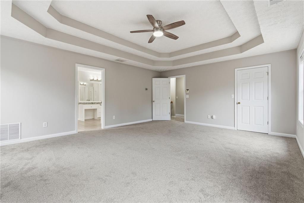 125 Nelson Oaks Drive Ball Ground, GA 30107 - Photo 22 of 41 an empty room with closet and windows
