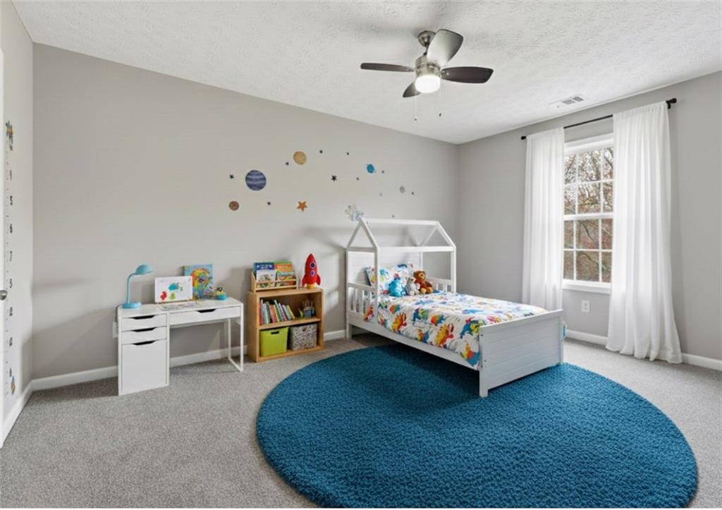 125 Nelson Oaks Drive Ball Ground, GA 30107 - Photo 27 of 41 a bedroom with furniture and window