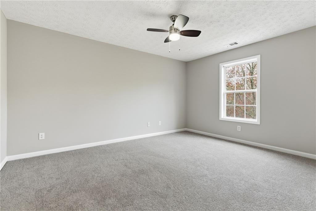 125 Nelson Oaks Drive Ball Ground, GA 30107 - Photo 28 of 41 a view of an empty room with a window