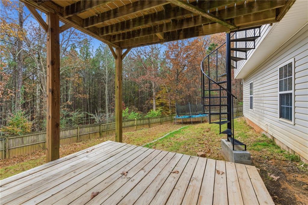 125 Nelson Oaks Drive Ball Ground, GA 30107 - Photo 37 of 41 a view of backyard with a deck and wooden floor