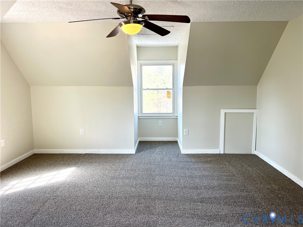 2049 Riddle Road Blackstone, VA 23824 - Photo 27 of 44 an empty room with windows and fan