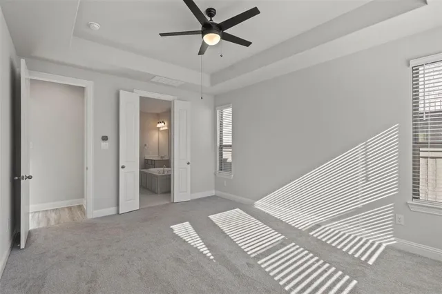 a view of a livingroom with a ceiling fan