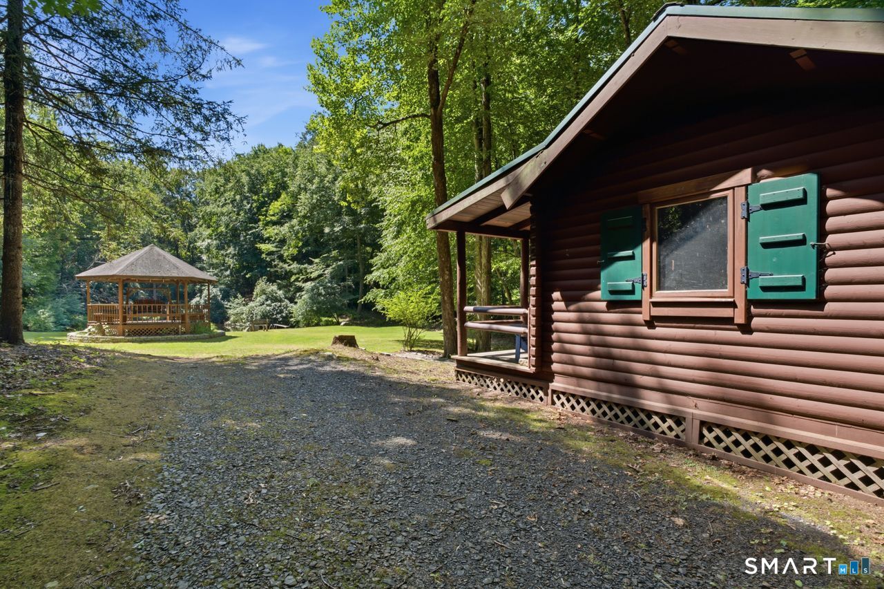 369 Saybrook Road Haddam, CT 06441 - Photo 21 of 29 Summer sleeping cabin, gazebo and lake all on your private property... a true escape from the everyday!