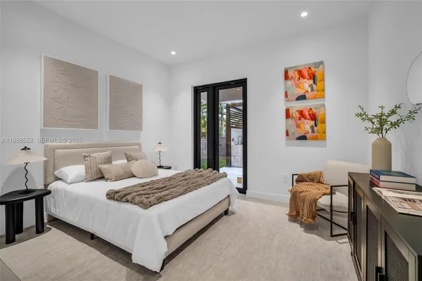 a bedroom with a bed and a couch