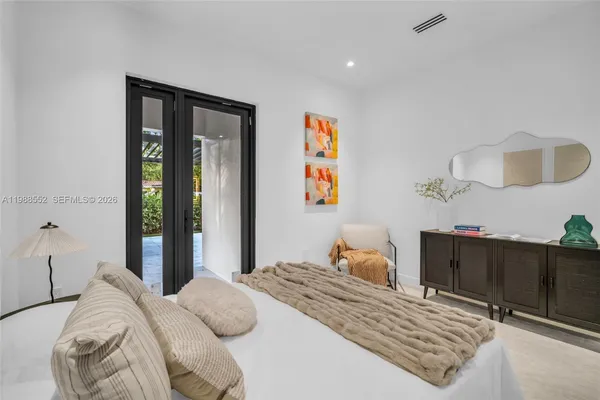 a bedroom with a bed and a cabinets