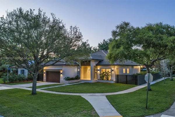 a front view of a house with garden