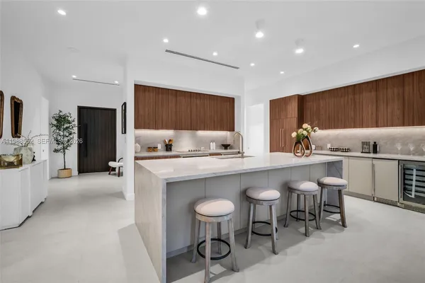 a kitchen with a sink cabinets and window