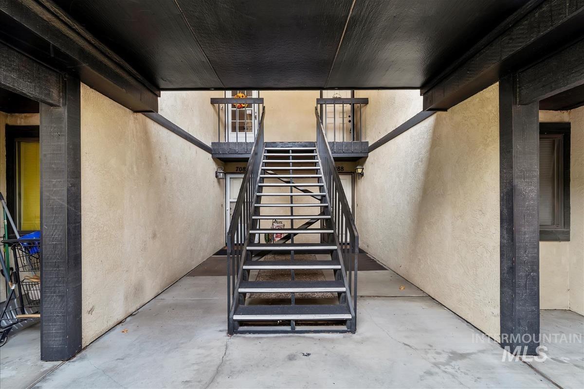 7084 West Colehaven Lane Boise, ID 83704 - Photo 22 of 23 Stairway with concrete floors and a textured wall