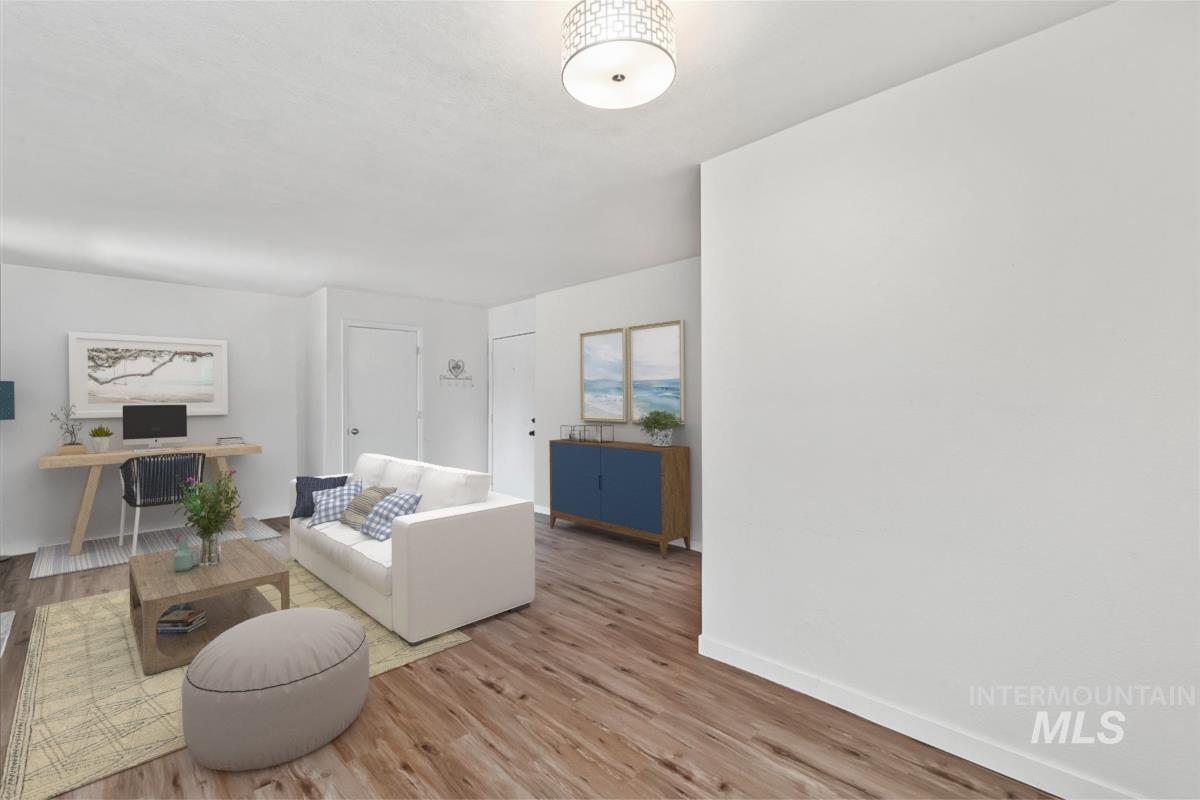 7084 West Colehaven Lane Boise, ID 83704 - Photo 4 of 23 Living area with wood finished floors and baseboards