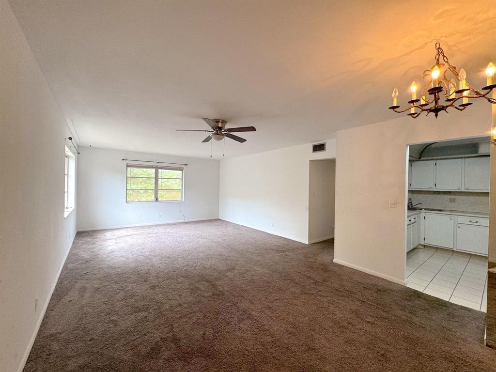 12 Northeast 19th Court, Unit 204A Wilton Manors, FL 33305 - Photo 13 of 21 a view of a kitchen with a sink and a cabinet