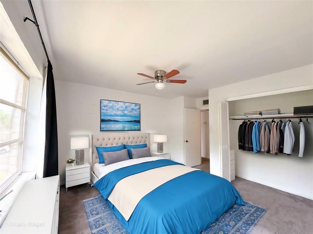 12 Northeast 19th Court, Unit 204A Wilton Manors, FL 33305 - Photo 2 of 21 a bedroom with a large bed and a window